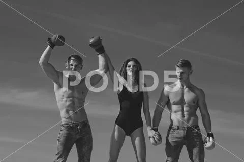 Winner and loser in boxing gloves with girl. Stock Photos