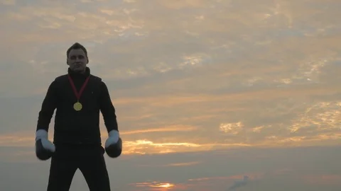 Winner boxer on a sunset background Stock Footage 83282458
