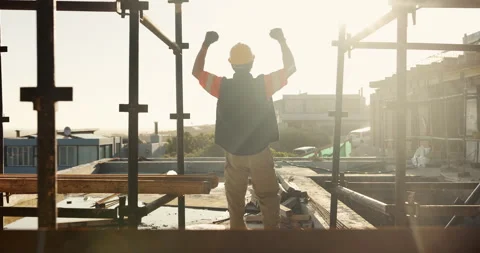 Winner, engineer and back of man on construction site for celebration, goals and Stock Footage 336785606