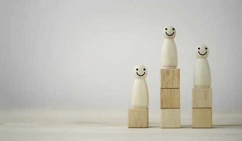 The winner first and second runner of smiley human figure wooden cube standing Stock Photos