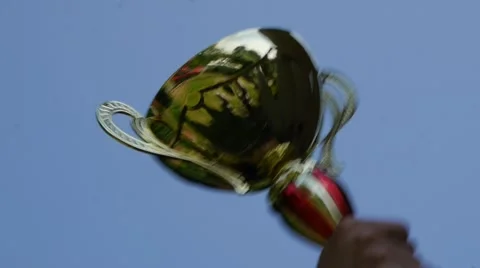 Winner holding the winning cup Stock Footage
