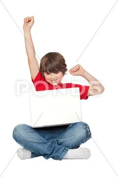 Winner little boy sitting with laptop Stock Photos