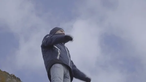 Winner man against sky background. slow motion Stock Footage 84969523