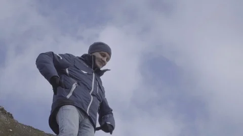 Winner man raising hands, sky background slow motion Stock Footage 84969715
