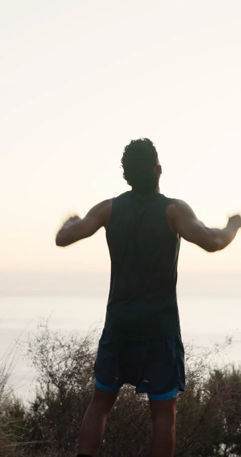 Winner, runner and back of man in nature for workout break, fitness goal and Stock Footage 337455573