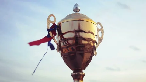 Winner trophy on sky background Stock Footage 94729035