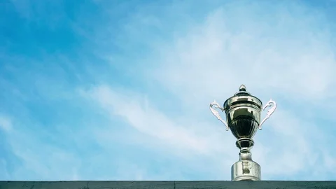 Winner trophy on sky background - time lapse Stock Footage 113540824