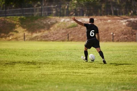 Winners practice until theyre perfect. a young man playing a game of rugby. Photos