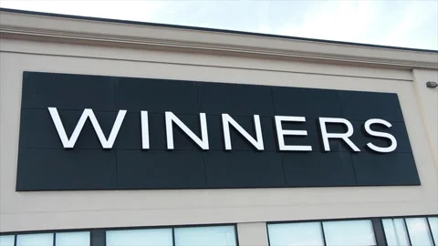 Winners store logo sign on front entrance of store clothing fashion apparel Stock Footage 251370646