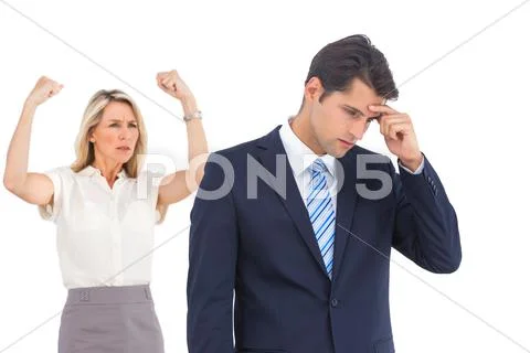 Winning businesswoman her anxious coworker Stock Photos