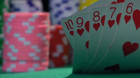 Winning combination, straight flush. Successful poker player checking his hand Stock Footage 62488810
