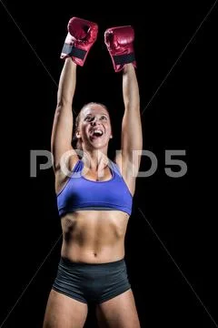 Winning fighter with arms raised Stock Photos