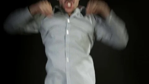  Winning man exulting looking at camera on neutral background  Stock Footage 80303508