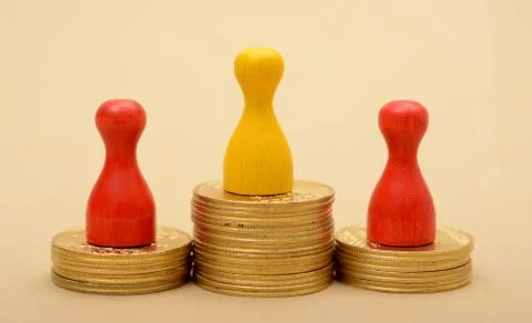 Winning Pawns concept on Golden Stack of Coins Stock Photos