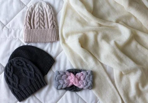 Winter accessory collection. Hat, scarf and mittens, on white background. Stock Photos