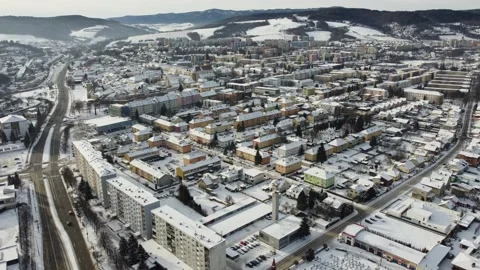 Winter aerial drone footage flight - housing estates of small town snow covered Stock Footage