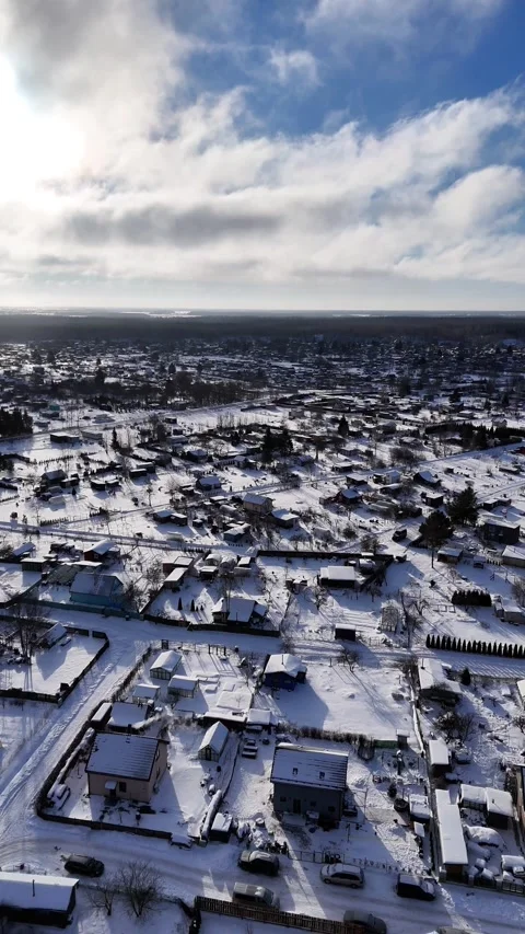 Winter Aerial Drone View of Snow Covered Countryside and Rural Village in Northe Stock Footage 338330358