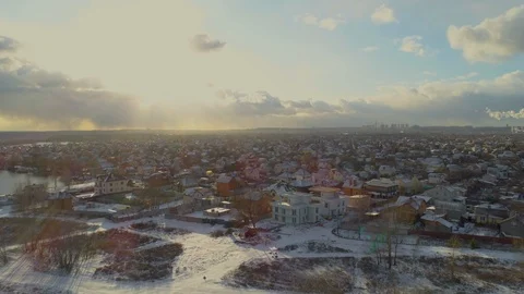 Winter aerial. Epic dramatic sunlight after snow storm over suburbia Stock Footage 124361134
