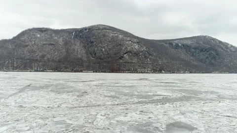 Winter Aerial-Freight Train Next To Mountain/Frozen River-Hudson Valley NY Stock Footage 170520861