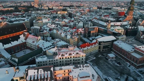 Winter Aerial Over Riga Old Town - Snowy Rooftops In Warm Sunset Light Stock Footage 346308020