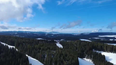 Winter aerial panorama of Black Forest with snow and blue sky Stock Footage 329937578