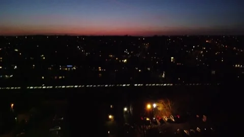 Winter Aerial Shot of Train Passing through Suburbs Stock Footage 135416721