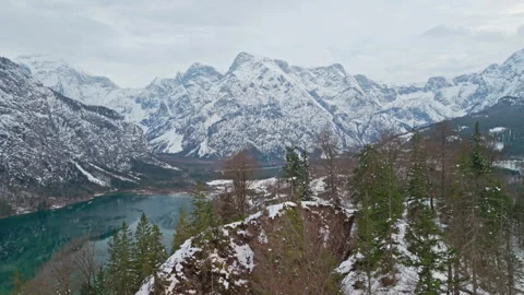 Winter aerial view of alpine mountains and forest ridge near lake Almsee 库存影片 346615051