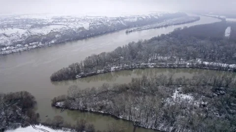A winter aerial view capturing the confluence of the Bega River into the Tisza Stock Footage 263359115