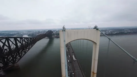 Winter aerial view of large bridge over wide river in quebe Stock Footage 321493384