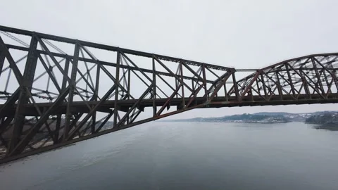 Winter aerial view of large bridge over wide river in quebe 스톡 동영상 321495503