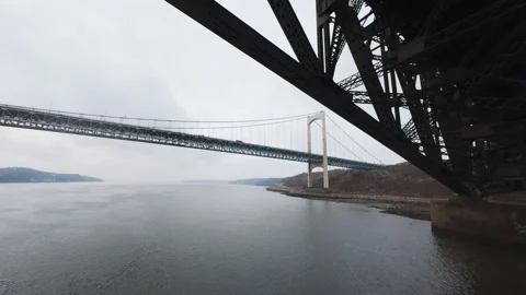 Winter aerial view of large bridge over wide river in quebe Stock Footage 321495529