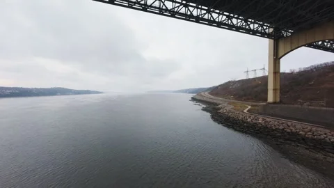 Winter aerial view of large bridge over wide river in quebe Stock Footage 321495620