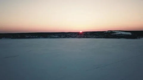 Winter aero frame, snow river and sunset Stock Footage 133357320
