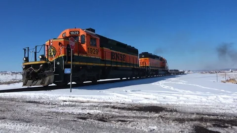 Winter afternoon dual engine short train approaches 2 clips Stock Footage 105190698