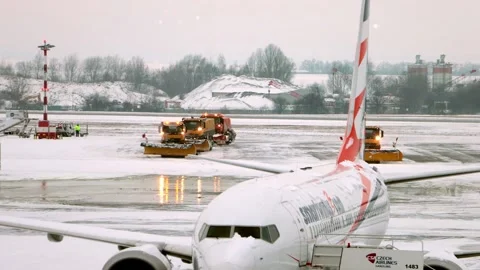 Winter Airport Operations with Snowplows Clearing Tarmac Stock Footage 345343693