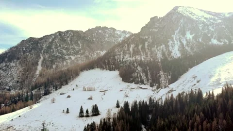 Winter alpine landscape: panoramic views of snow-covered mountain ranges with co Stock Footage 303304906