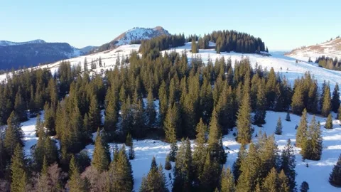 Winter alpine landscape: panoramic views of snow-covered mountain ranges with co Stock Footage 303638362
