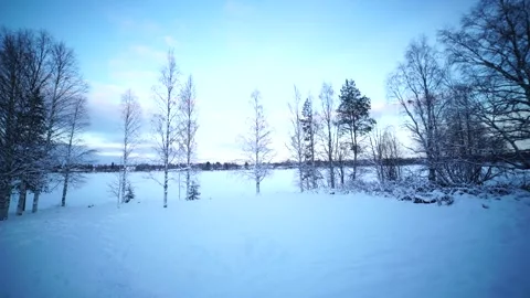 Winter atmosphere by the snow-covered river in Kemijoki, Finland Video stock 287928261