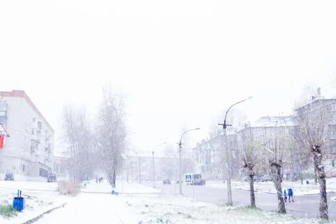 WINTER ATTACK - People walking through the blizzard . Stock Photos