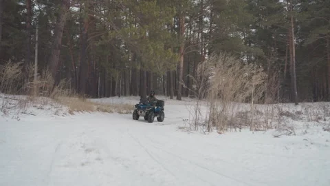 Winter ATV maneuver visuals captured. Intense snowcovered landscape ATV stunts Stock Footage 346251686