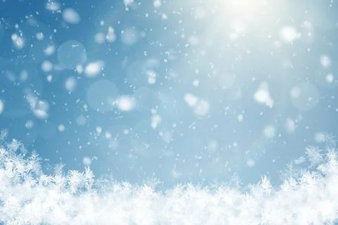Winter background with bright sunlight, soft falling snow, bokeh light effe.. Stock Photos