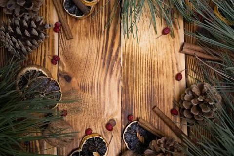 Winter background with Christmas elements Pine cones and branches cinnamon Stock Photos