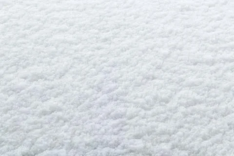 Winter background: fresh clean even snow, large snowflakes Stock Photos