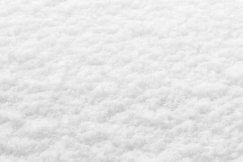 Winter background: fresh clean even snow, large snowflakes Stock Photos