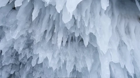 Winter background of frozen icicles on ceiling in cave. icy frozen splashes. Stock Footage 263651804