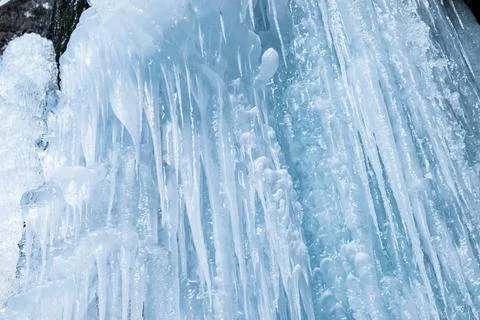Winter background of ice, icicles and ice stalactites Stock Photos