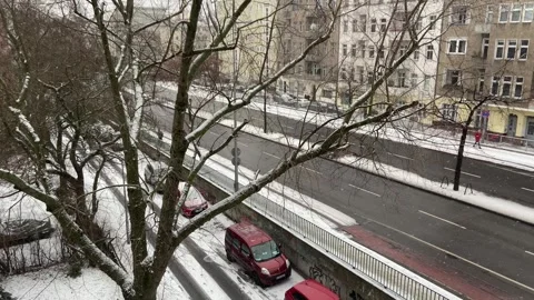 Winter balcony POV facing snowy Putlitzbruecke bridge in Berlin Moabit Stock Footage 331300201