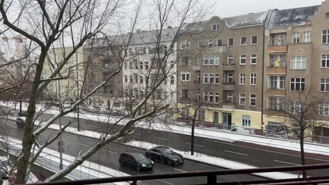 Winter balcony POV facing snowy Putlitzbruecke bridge in Berlin Moabit Stock Footage 331300260