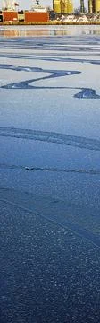 Winter banner background.  Bluewater surface texture with melting ice and rip Stock Photos