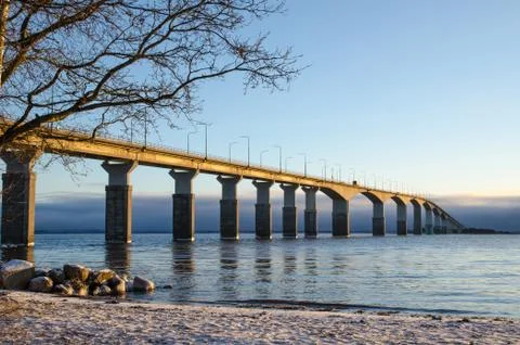 Winter beach by the bridge Stock Photos